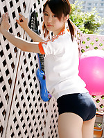 Naoko Sawano Asian in sports outfit plays with balls in garden